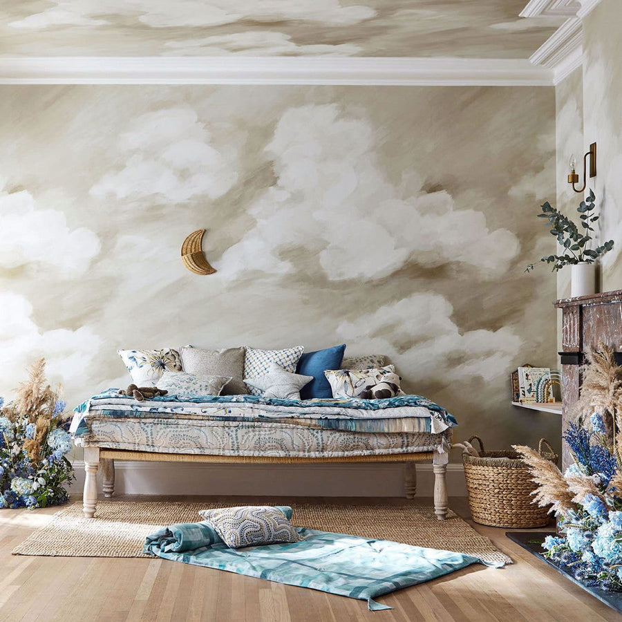 Air Colour 4 Golden Light mural by Harlequin, painterly gold clouds and a crescent moon behind a dressed bed