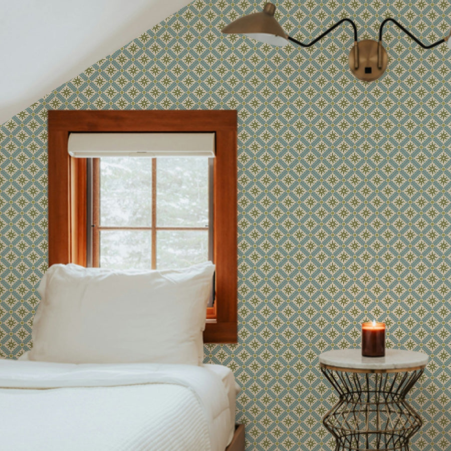Nova and Sol wallpaper by Josephine Munsey, a small hand painted celestial print papered across the sloping walls of an attic bedroom