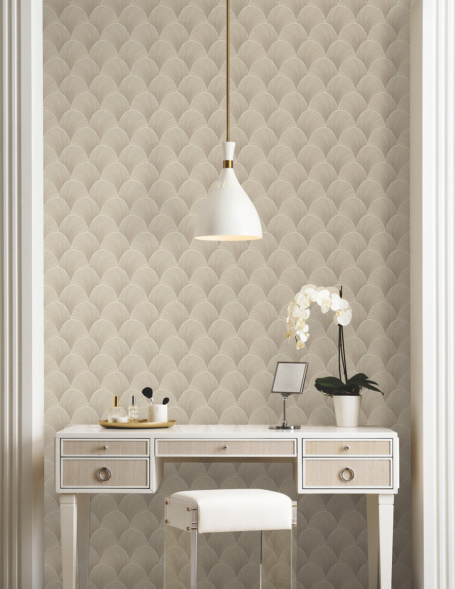 Candice Olson Metallic Scallop Beige wallpaper by York Wallcoverings, a large quilted metallic scallop behind a white dressing table and an orchid