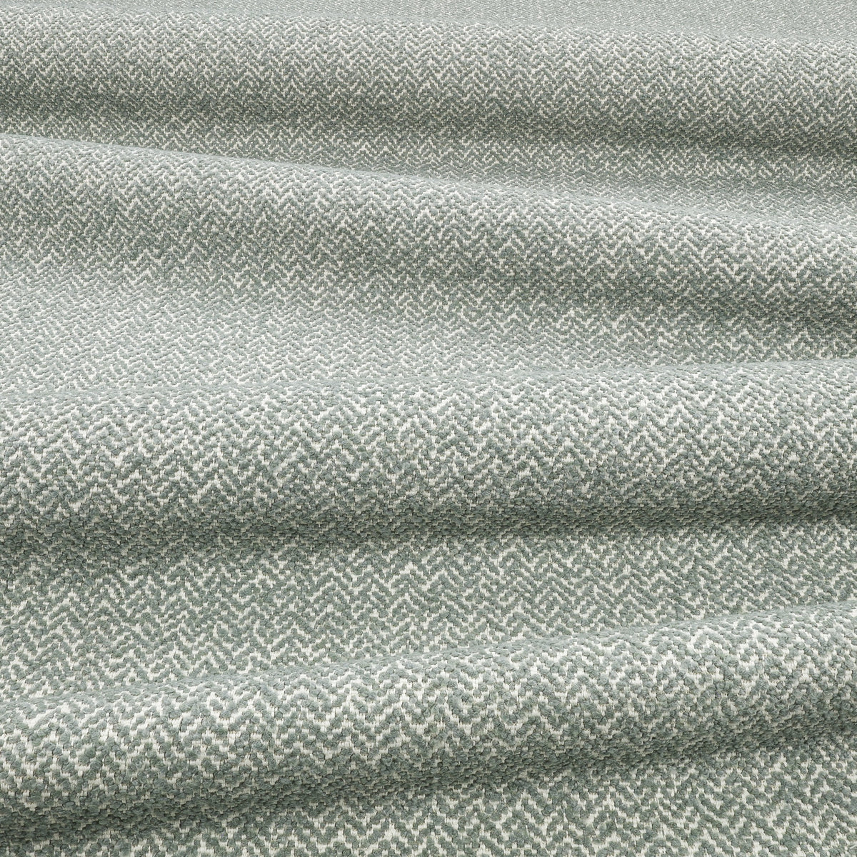 Arley Sea Holly Lowen Fabric by Romo draped