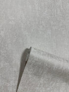 Mottled Specks Pale Silver New Touch Wallpaper by Galerie — roll shot