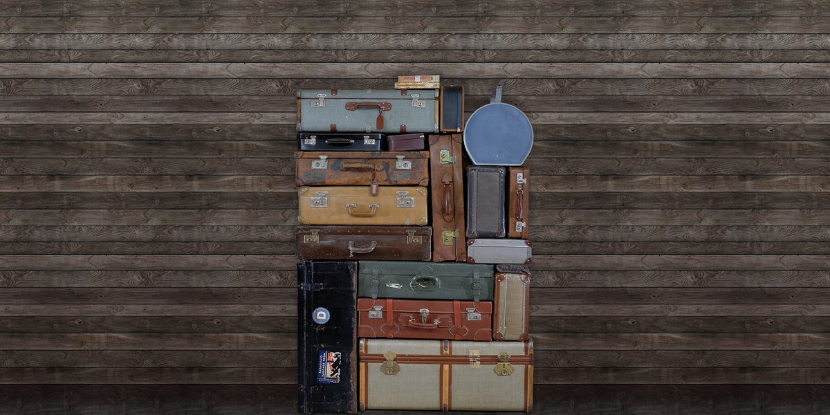 R14063 Stacked Suitcases Pile Passion Mural by Rebel Walls