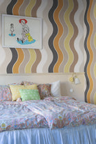 R19421 Seventies Waves Orange Maximalism Mural by Rebel Walls