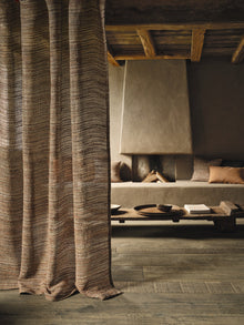 Canapa Cloth Terracotta Fabric by Mark Alexander in a room