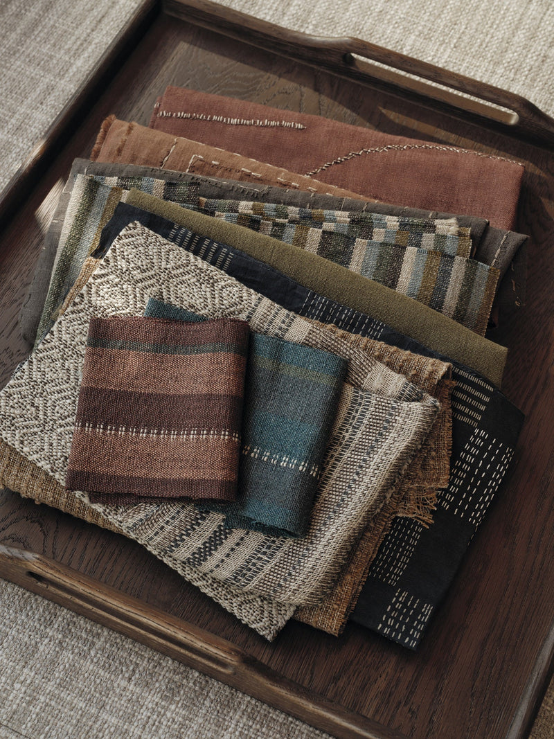Kuba Embroidery Gunmetal Homespun Embroideries Fabric by Mark Alexander in a room